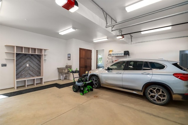 21185 County Road 16, Oak Creek, CO 80467 - garage featuring a garage door opener and electric panel