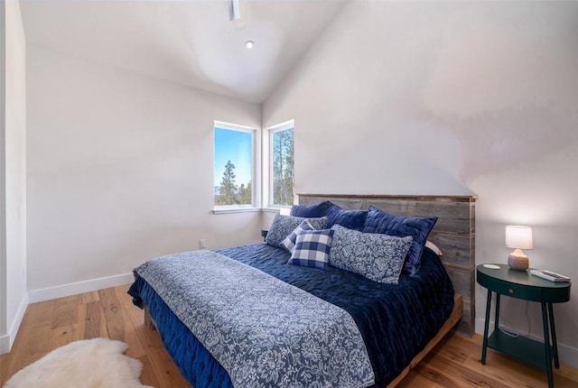 21185 County Road 16, Oak Creek, CO 80467 - bedroom with baseboards, wood finished floors, and vaulted ceiling