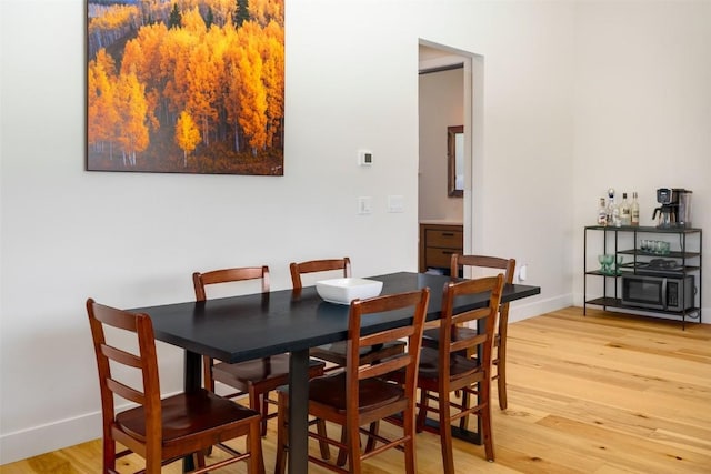 21185 County Road 16, Oak Creek, CO 80467 - dining area featuring baseboards and light wood finished floors