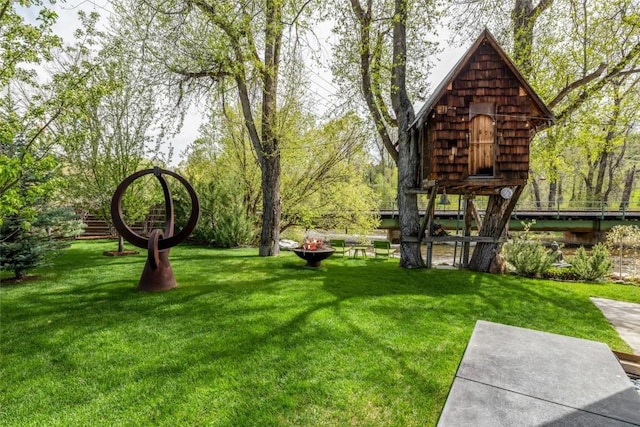 410 River Rd, Steamboat Springs, CO 80487 - view of green lawn featuring a fire pit
