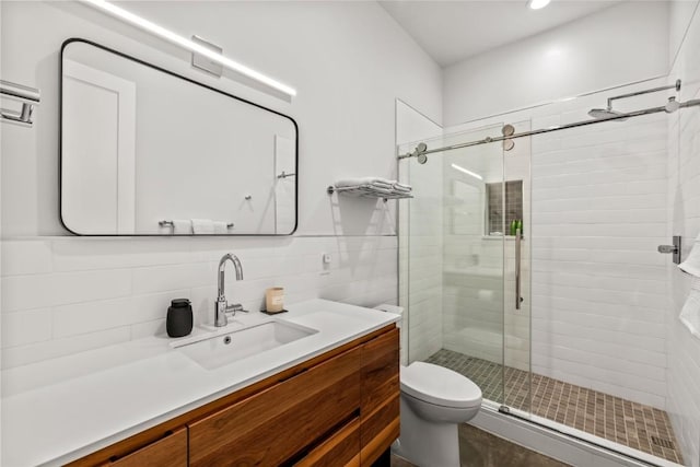 410 River Rd, Steamboat Springs, CO 80487 - bathroom featuring a stall shower, vanity, toilet, tasteful backsplash, and recessed lighting