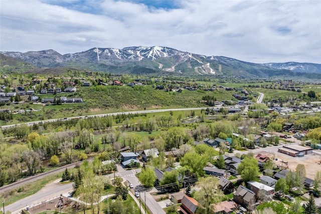 410 River Rd, Steamboat Springs, CO 80487 - aerial view of property and surrounding area with mountains and nearby suburban area
