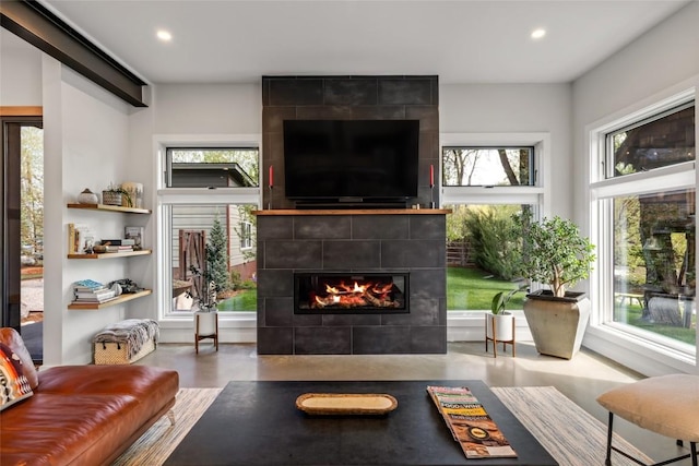 410 River Rd, Steamboat Springs, CO 80487 - living area with a tiled fireplace, recessed lighting, and plenty of natural light