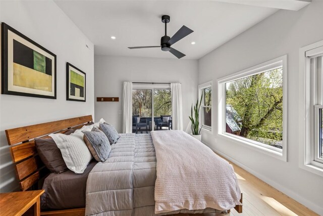 410 River Rd, Steamboat Springs, CO 80487 - bedroom with access to exterior, multiple windows, wood finished floors, recessed lighting, and baseboards