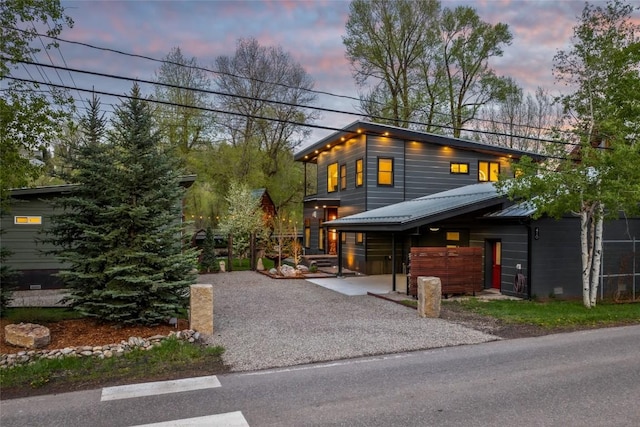 410 River Rd, Steamboat Springs, CO 80487 - modern home featuring asphalt driveway and metal roof