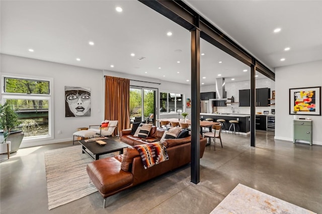 410 River Rd, Steamboat Springs, CO 80487 - living room with concrete floors, recessed lighting, and baseboards