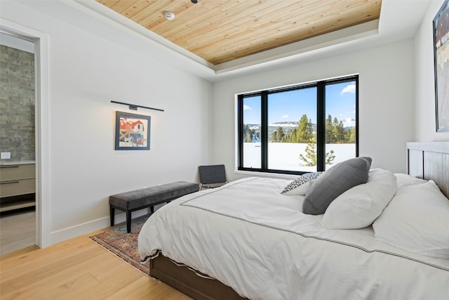 403 Revett Dr, Breckenridge, CO 80424 - bedroom featuring a tray ceiling, wooden ceiling, and light wood-style flooring