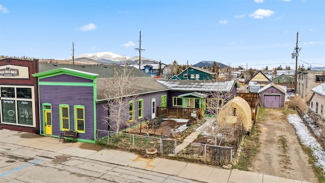 view of front of property with fence private yard and a residential view