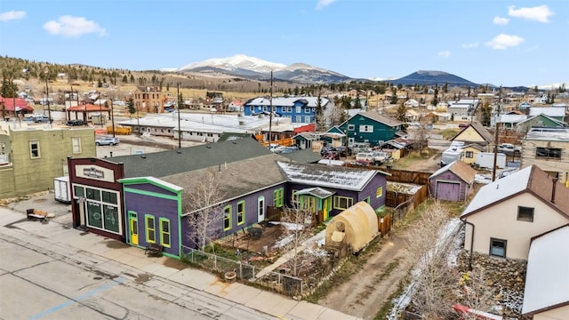drone / aerial view featuring a residential view and a mountain view