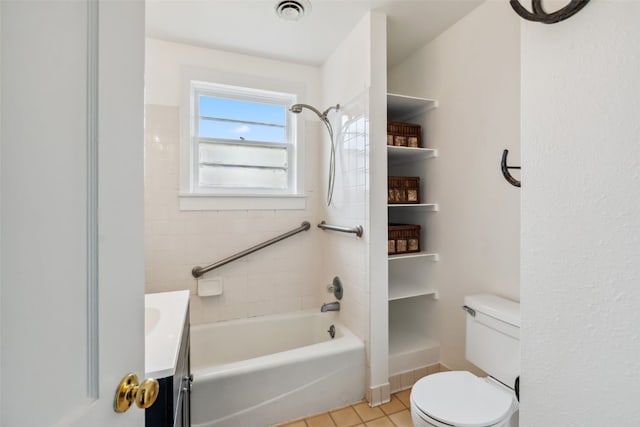 bathroom featuring toilet, visible vents, tile patterned flooring, vanity, and tub / shower combination