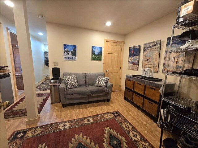 living room with recessed lighting and light wood-type flooring