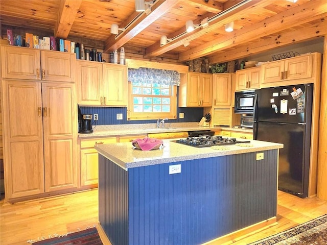 kitchen with light wood-style flooring, a sink, beamed ceiling, wood ceiling, and black appliances