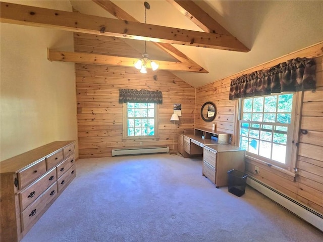 carpeted home office featuring vaulted ceiling with beams, wood walls, and a baseboard radiator