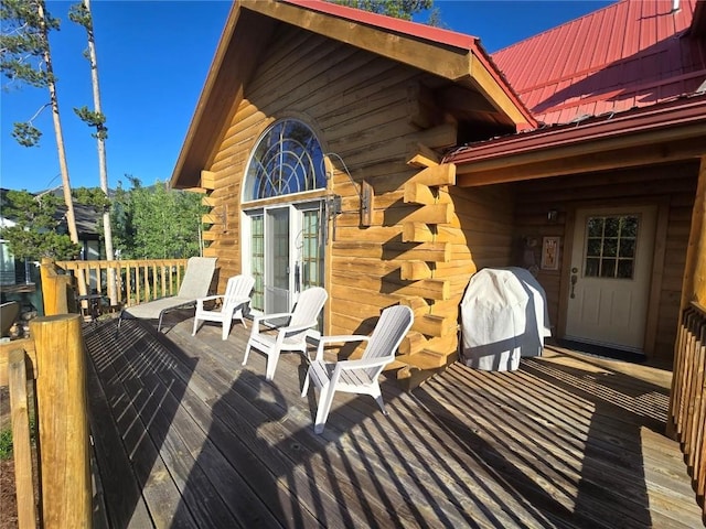 wooden deck with grilling area