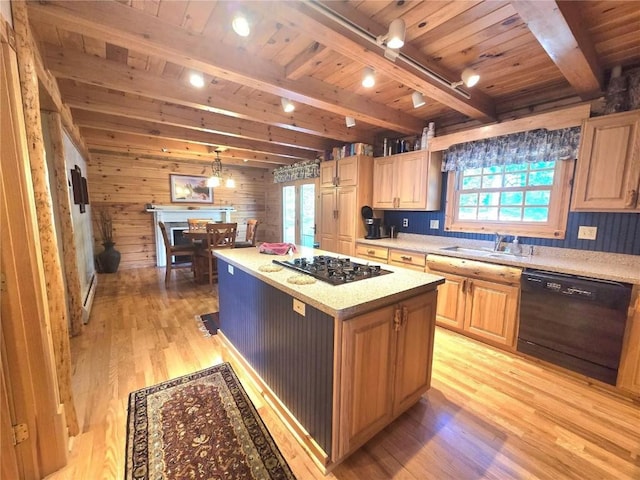 kitchen featuring a sink, plenty of natural light, black appliances, wood ceiling, and light wood finished floors