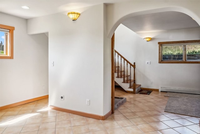 240 S Main St, Alma, CO 80420 - spare room with arched walkways, baseboard heating, stairs, light tile patterned flooring, and recessed lighting