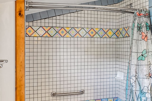 interior space featuring a tile shower