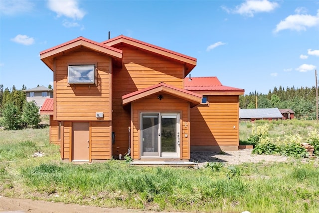 back of property with metal roof