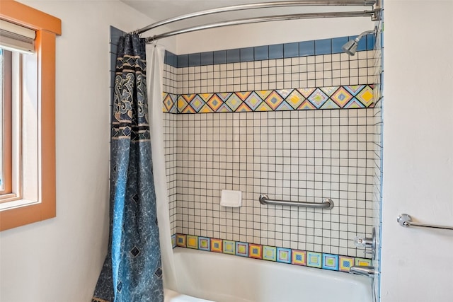 full bathroom with shower / bath combo with shower curtain