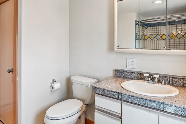 full bathroom featuring toilet and vanity