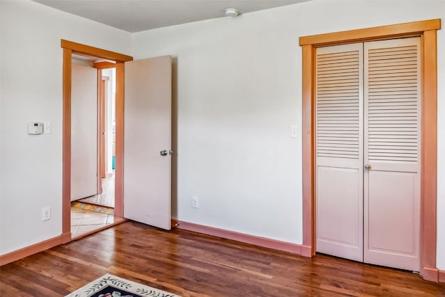 240 S Main St, Alma, CO 80420 - unfurnished bedroom featuring wood finished floors, a closet, and baseboards