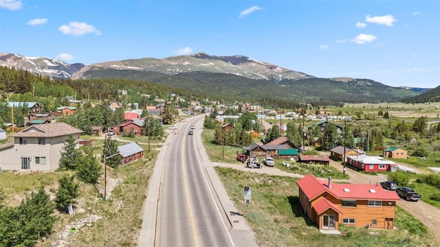 drone / aerial view featuring a residential view and a mountain view