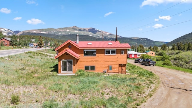 view of property exterior featuring a mountain view