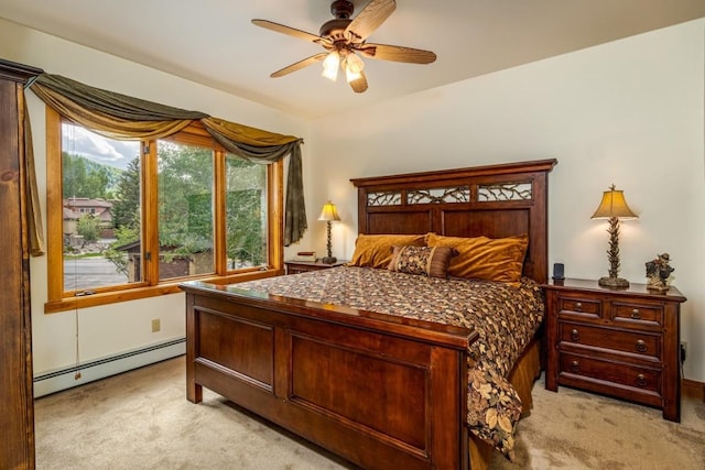 2755 Waterstone Ln Unit 35, Steamboat Springs, CO 80487 - bedroom featuring a baseboard radiator, light carpet, and ceiling fan
