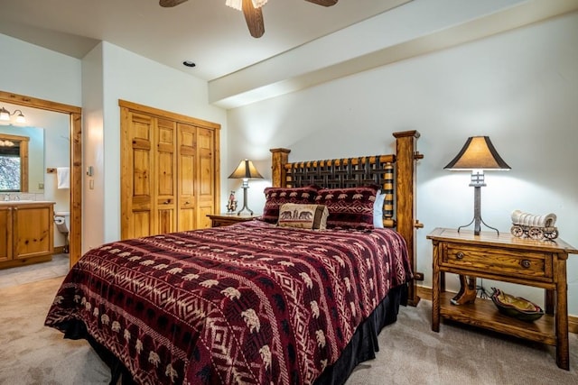 2755 Waterstone Ln Unit 35, Steamboat Springs, CO 80487 - bedroom featuring light carpet, a closet, ensuite bath, a sink, and ceiling fan