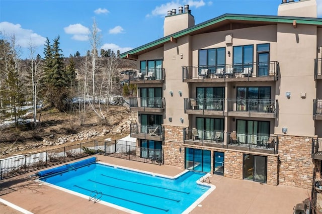 2883 Burgess Creek Rd Unit 302, Steamboat Springs, CO 80487 - community pool featuring a patio