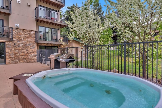 2883 Burgess Creek Rd Unit 302, Steamboat Springs, CO 80487 - view of swimming pool with a hot tub and grilling area
