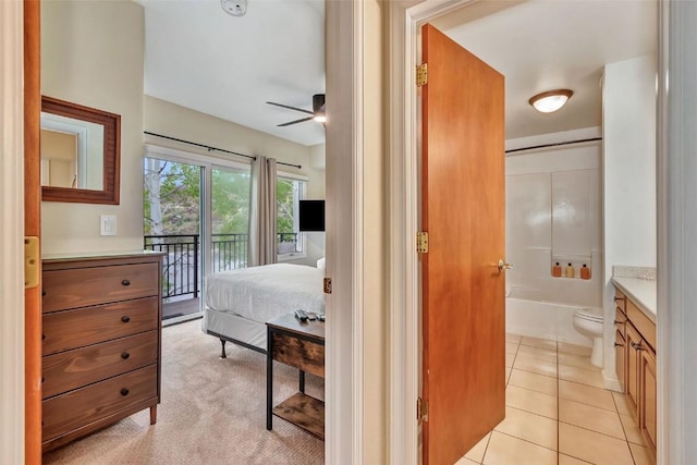 2883 Burgess Creek Rd Unit 302, Steamboat Springs, CO 80487 - bedroom with access to outside, ensuite bathroom, and light tile patterned floors
