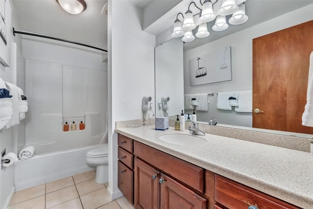2883 Burgess Creek Rd Unit 302, Steamboat Springs, CO 80487 - bathroom featuring toilet, tile patterned floors, vanity, and shower / tub combination