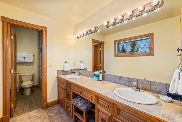 2685 Timber Ct Unit 2, Steamboat Springs, CO 80487 - full bathroom featuring a sink, double vanity, and toilet