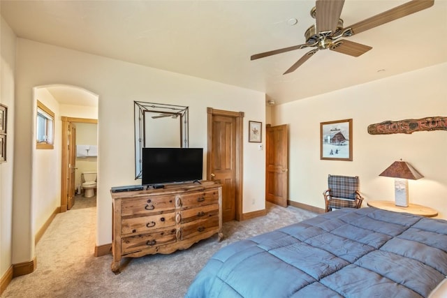 2685 Timber Ct Unit 2, Steamboat Springs, CO 80487 - bedroom with arched walkways, ceiling fan, baseboards, and light carpet