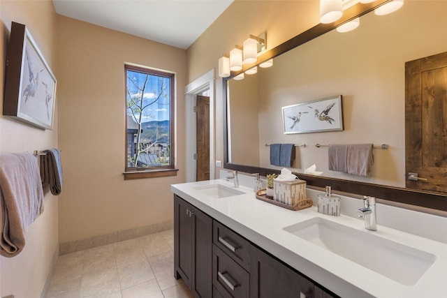 77 Red Quill Ln, Breckenridge, CO 80424 - full bath featuring baseboards, double vanity, and tile patterned flooring