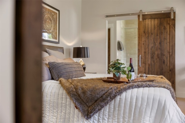 77 Red Quill Ln, Breckenridge, CO 80424 - bedroom featuring a barn door