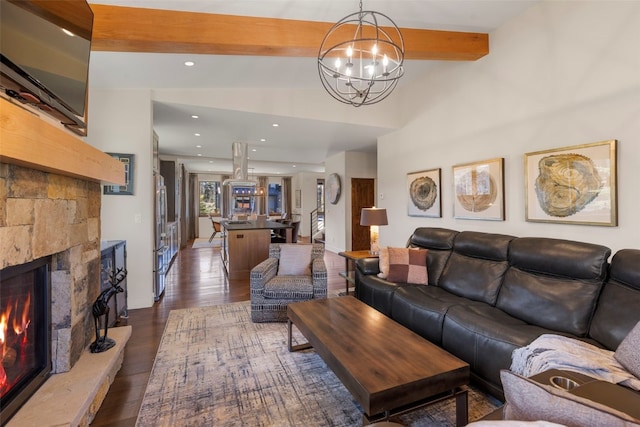 77 Red Quill Ln, Breckenridge, CO 80424 - living area featuring beamed ceiling, a chandelier, a fireplace, wood finished floors, and recessed lighting