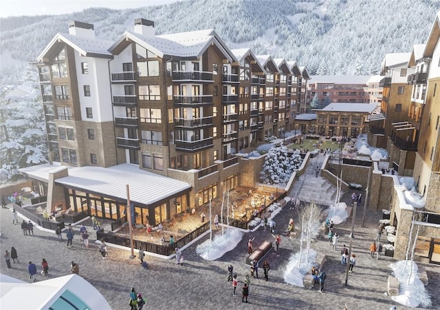 75 Hunki Dori Ct Unit E107, Keystone, CO 80435 - snow covered building with a mountain view and a view of apartment building / complex