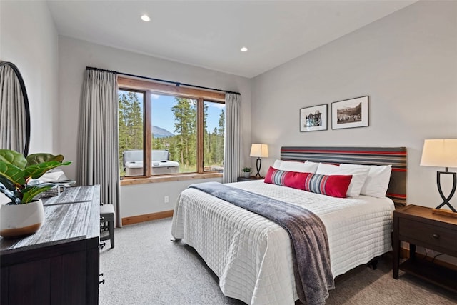 bedroom featuring light colored carpet