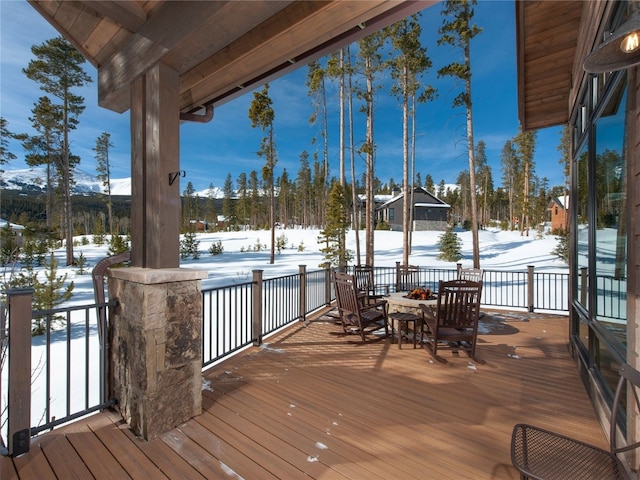 view of snow covered deck