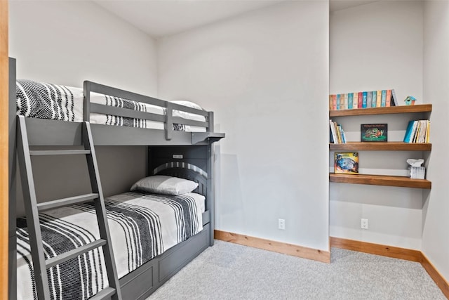 bedroom featuring light carpet