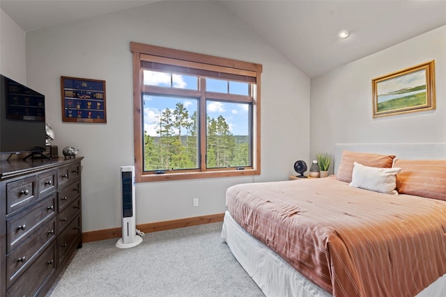 bedroom with light carpet and vaulted ceiling