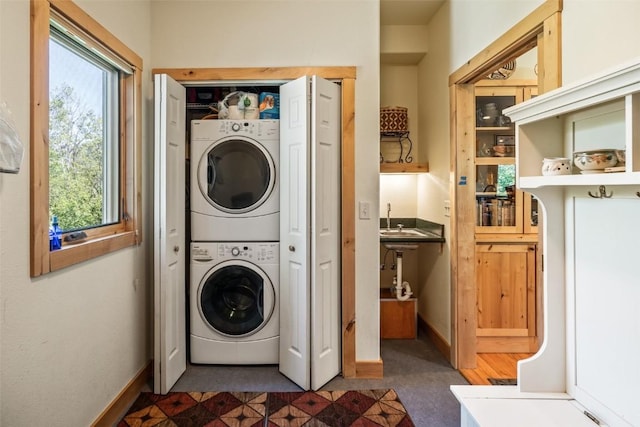 31020 Fallen Falcon Trl, Oak Creek, CO 80467 - laundry area with stacked washer and clothes dryer and baseboards