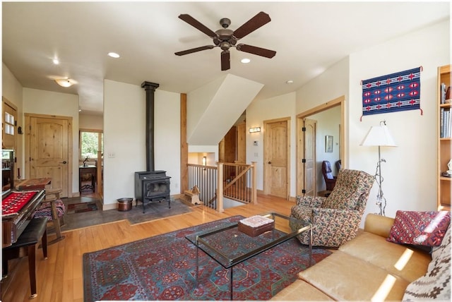 31020 Fallen Falcon Trl, Oak Creek, CO 80467 - living area featuring ceiling fan, wood finished floors, a wood stove, and recessed lighting