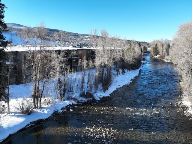 1030 Blue River Pkwy Unit A-302, Silverthorne, CO 80498 - property view of water featuring a mountain view