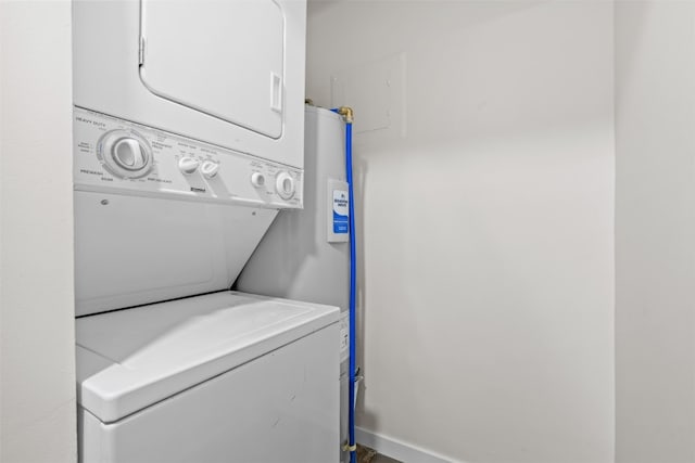 laundry area with stacked washer / drying machine