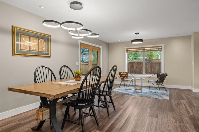 27401 Brandon Cir, Steamboat Springs, CO 80487 - dining area featuring baseboards, wood finished floors, and a chandelier