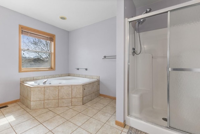27401 Brandon Cir, Steamboat Springs, CO 80487 - full bath with baseboards, tile patterned flooring, a bath, and a shower stall