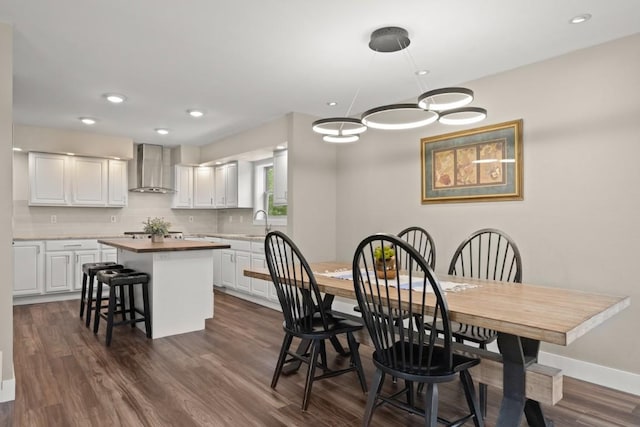 27401 Brandon Cir, Steamboat Springs, CO 80487 - dining area with dark wood-type flooring, baseboards, recessed lighting, and a chandelier